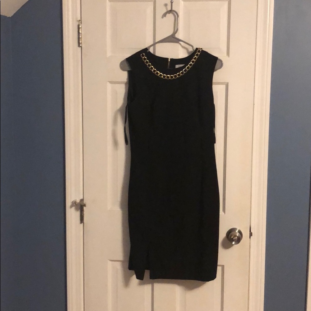 Calvin Klein black dress with gold necklace